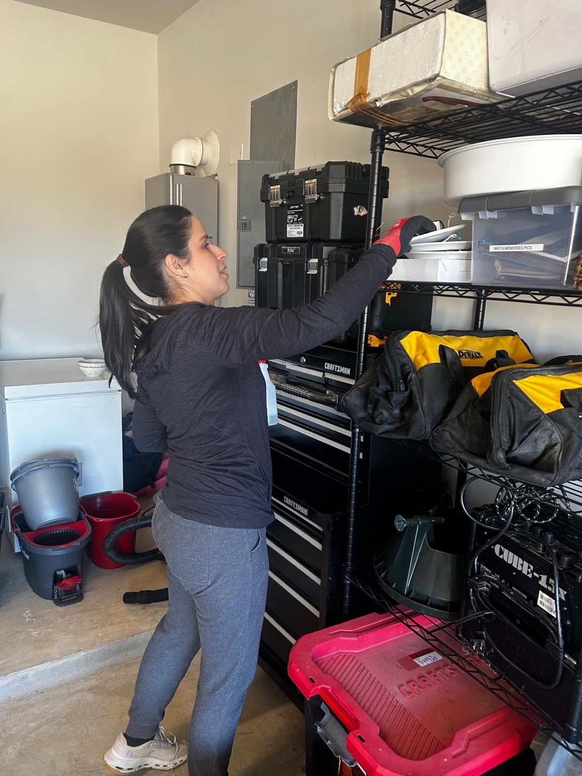 Aury organizing a client's garage